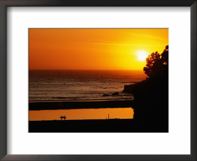Surfers Walking On Beach At Sunset, Santa Cruz, United States Of America by Jerry Alexander Pricing Limited Edition Print image