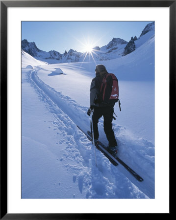 A Woman Skiing In The Selkirk Mountains, British Columbia, Canada by Jimmy Chin Pricing Limited Edition Print image