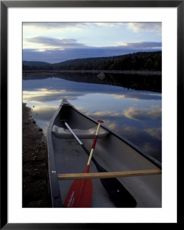Canoe On A River Shore, Northern Forest, Maine, Usa by Jerry & Marcy Monkman Pricing Limited Edition Print image