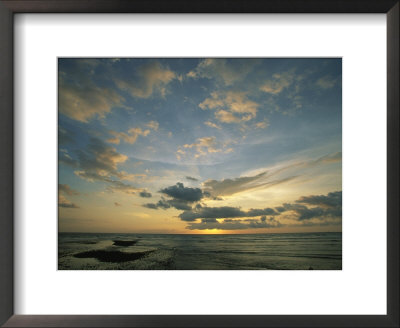 Clouds Silhouetted Against The Setting Sun Over The Pacific Ocean by Steve Winter Pricing Limited Edition Print image