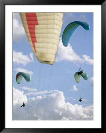 View From Below At Soaring Paragliders Against A Cloudy Sky, Near Draper, Utah by Skip Brown Pricing Limited Edition Print image