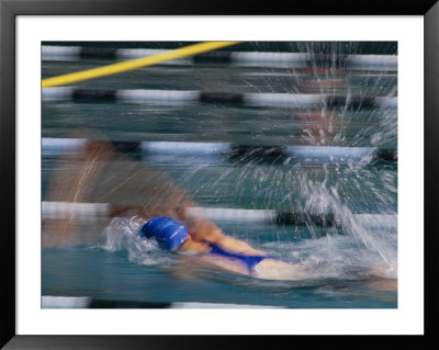 A Swimmer Races Through The Water At A Swimming Competition by Michael S. Lewis Pricing Limited Edition Print image
