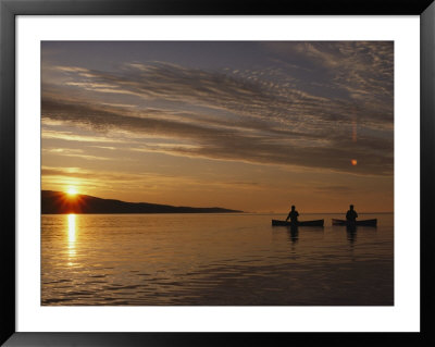 Canoeing At Dawn On Minnesotas Lake Superior by Annie Griffiths Belt Pricing Limited Edition Print image