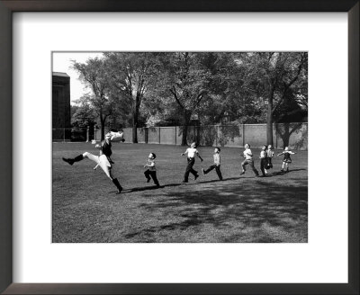 Uniformed Drum Major For University Of Michigan Marching Band Practicing His High Kicking Prance by Alfred Eisenstaedt Pricing Limited Edition Print image