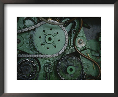 A Close View Of Gears And A Drive Chain On A Piece Of Machinery by Raul Touzon Pricing Limited Edition Print image