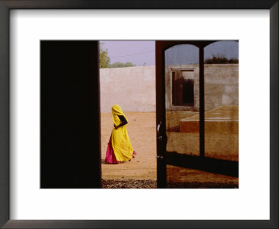 A Person Walking Past An Open Doorway by Michael S. Lewis Pricing Limited Edition Print image