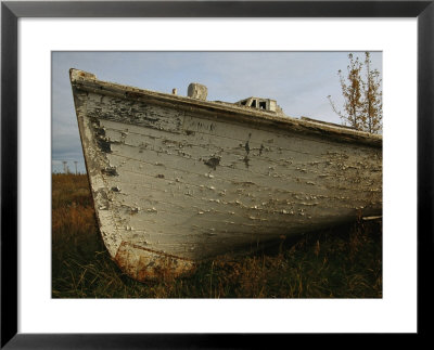 A Wooden Boat Lies Abandoned At The Hay River Shipyard by Raymond Gehman Pricing Limited Edition Print image
