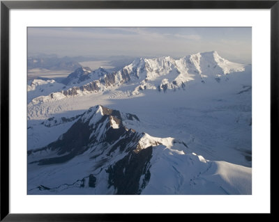 Aerial Of Glaciers, Mountains And Nunataks In The Chugach Icefield, Alaska by Rich Reid Pricing Limited Edition Print image