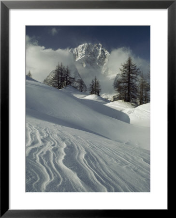 Mount Blanc Partially Obscured By Clouds In Snowy Landscape by Gordon Wiltsie Pricing Limited Edition Print image
