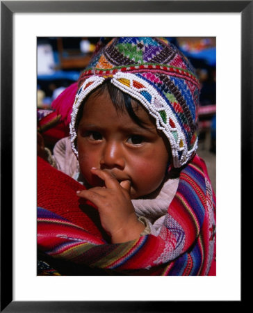 Traditionally Dressed Baby At Market, Pisac, Cuzco, Peru by Grant Dixon Pricing Limited Edition Print image