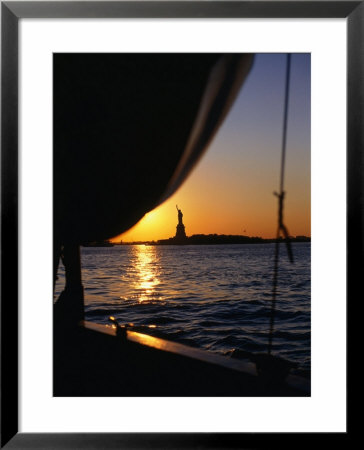 Statue Of Liberty At Sunset From Staten Island Ferry, New York City, New York, Usa by Angus Oborn Pricing Limited Edition Print image