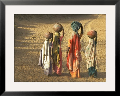 Girls Wearing Sari With Water Jars Walking In The Desert, Pushkar, Rajasthan, India by Keren Su Pricing Limited Edition Print image