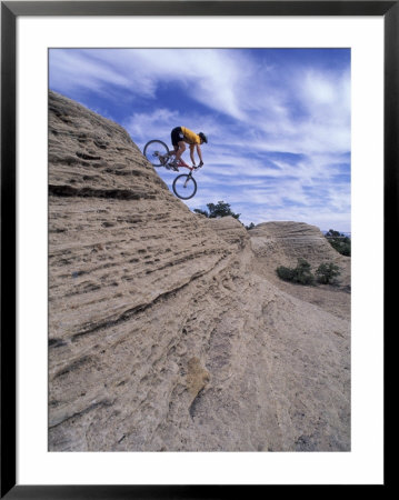 Active Male Rides Slickrock Ridge, Utah, Usa by Howie Garber Pricing Limited Edition Print image