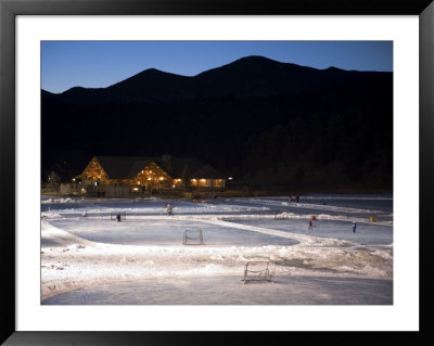 Ice Skating And Hockey On Evergreen Lake, Colorado, Usa by Chuck Haney Pricing Limited Edition Print image