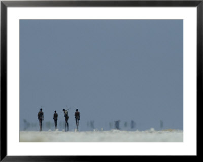 Bushmen Armed With Bows And Arrows Cross A Salt Pan by Chris Johns Pricing Limited Edition Print image
