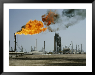 A Flame Spurts From An Oil Refinery In Saudi Arabia by W. Robert Moore Pricing Limited Edition Print image