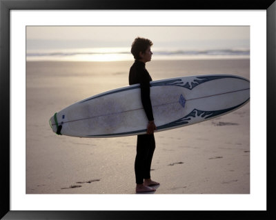 Surfer On A Beach, North Devon, England by Lauree Feldman Pricing Limited Edition Print image
