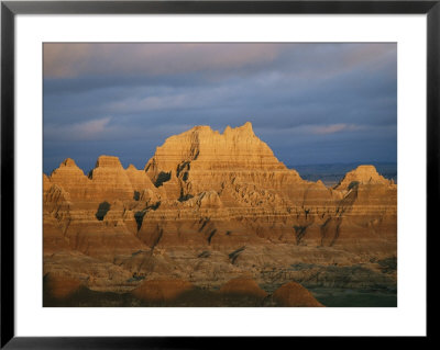 Sunset On The Claystone Buttes Of The Badlands Near Cedar Pass by Annie Griffiths Belt Pricing Limited Edition Print image
