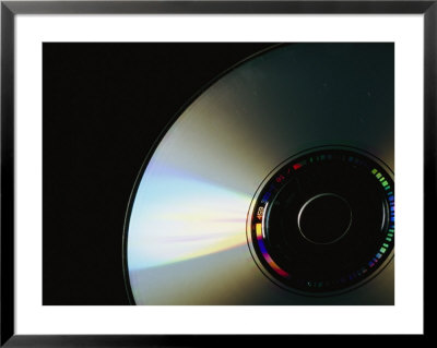 Rainbow Reflections Bounce Off The High Tech Surface Of A Cd by Taylor S. Kennedy Pricing Limited Edition Print image