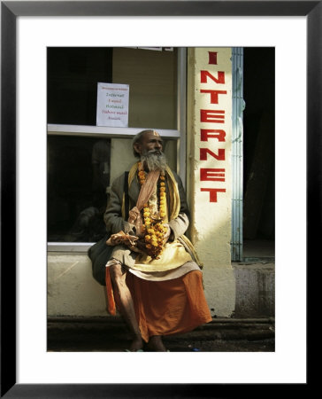 Sadhu Sitting Outside An Internet Cafe, Varanasi, Uttar Pradesh State, India by James Gritz Pricing Limited Edition Print image