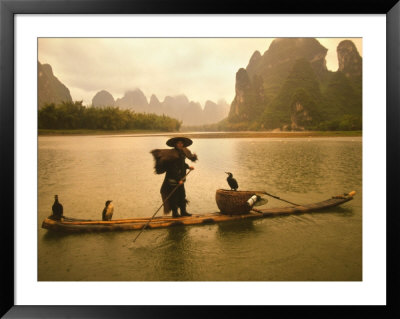 Fisherman In Bamboo Raft On The Li River, China by Keren Su Pricing Limited Edition Print image