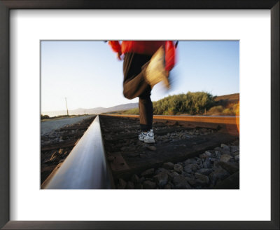 An Athlete Runs On Railroad Tracks Toward The Mountains by Joy Tessman Pricing Limited Edition Print image