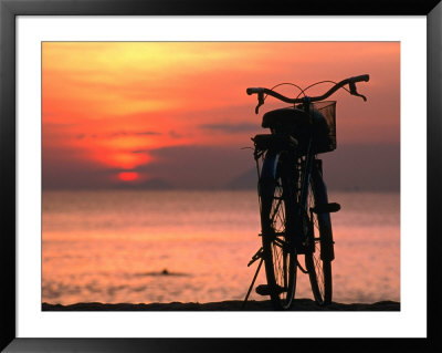Bicycle Silhouetted Against Sunset On Nha Trang Beach, Nha Trang, Khanh Hoa, Vietnam by John Banagan Pricing Limited Edition Print image
