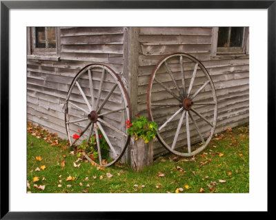 Old Wooden Barn With Wagon Wheels In Rural New England, Maine, Usa by Joanne Wells Pricing Limited Edition Print image