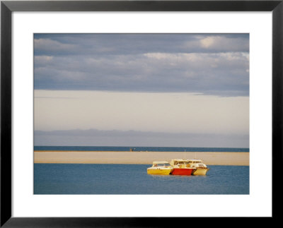 Three Colorful Fishing Boats Sit Off The Shore Of The Kalbarri Resort by Bill Ellzey Pricing Limited Edition Print image