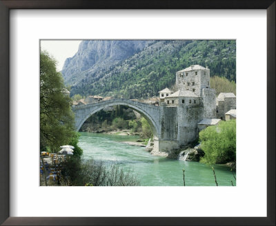 The Turkish Bridge Over The River Neretva Dividing The Town, Mostar, Bosnia, Bosnia-Herzegovina by Michael Short Pricing Limited Edition Print image