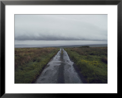 Wet Road Leading Off To Nowhere With A Storm Coming In From The Atlantic Ocean by Sam Abell Pricing Limited Edition Print image