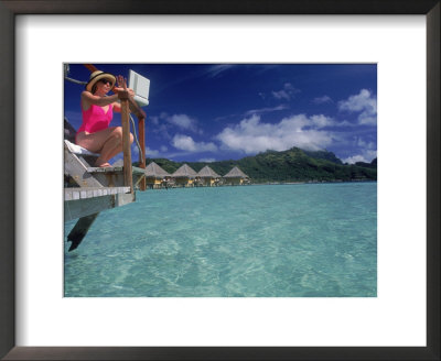 Woman With Laptop Computer In Bora Bora by Lonnie Duka Pricing Limited Edition Print image