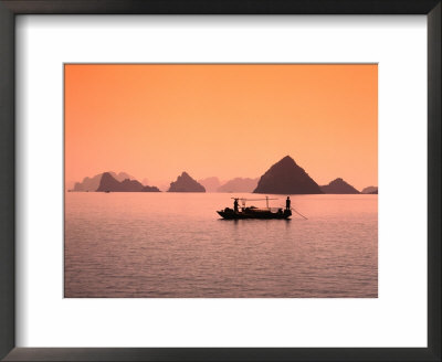 Boat On Bay Waters With Islets In Background, Halong Bay, Vietnam by Manfred Gottschalk Pricing Limited Edition Print image