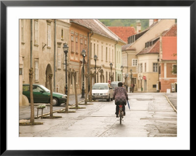 Bicyclist In Jurisics Ter Square, Western Transdanubia, Hungary by Walter Bibikow Pricing Limited Edition Print image