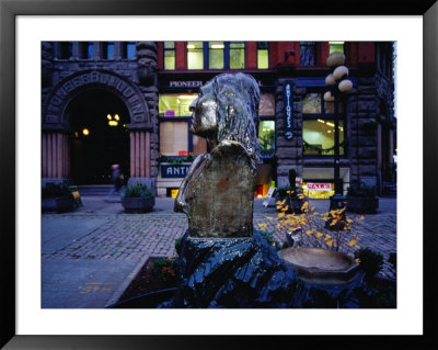 Water Fountain And Bust Of Chief Seattle In Pioneer Place Park, Seattle, Washington, Usa by Lawrence Worcester Pricing Limited Edition Print image