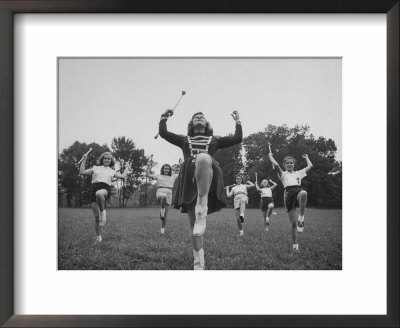 Prize Winning Drum Majorette Teaching Younger Girls To Twirl Batons For A Summer Job by Walter Sanders Pricing Limited Edition Print image