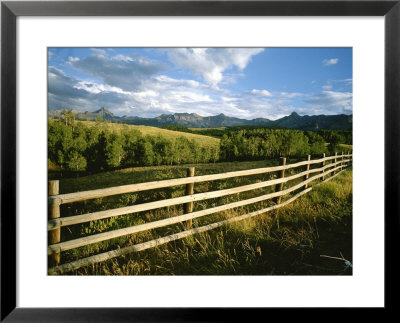 A Rustic Scene Of A Fence With Mountains In The Distance In Colorado by Taylor S. Kennedy Pricing Limited Edition Print image