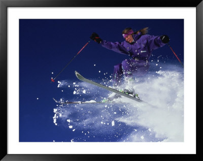 Woman On Skis Jumping Off Soft Powder by Randy Klamm Pricing Limited Edition Print image