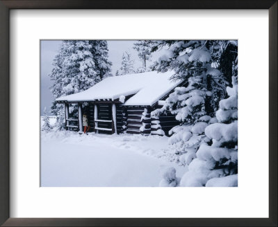 Snow Covered Log Cabin In Woods by Mick Roessler Pricing Limited Edition Print image