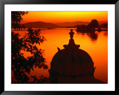 Silhouette Of Domed Building On Shore Of Lake Pichola At Sunset, Udaipur, Rajasthan, India by Dallas Stribley Pricing Limited Edition Print image