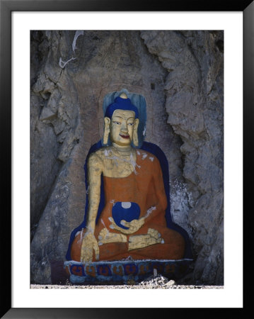 A Painted Stone Buddha Near Lhasa, Tibet by Gordon Wiltsie Pricing Limited Edition Print image