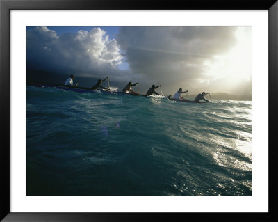 A Racing Team Gets In Some Practice Paddling Their Outrigger Canoe by Jodi Cobb Pricing Limited Edition Print image