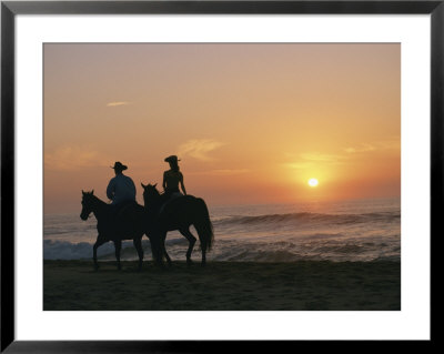 Two People On Horseback Ride Along An Ocean Shoreline At Sunset by Roy Toft Pricing Limited Edition Print image