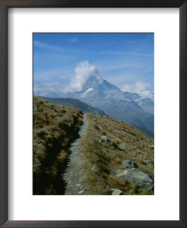 View Down A Trail Towards The Cloud-Shrouded Matterhorn by Taylor S. Kennedy Pricing Limited Edition Print image