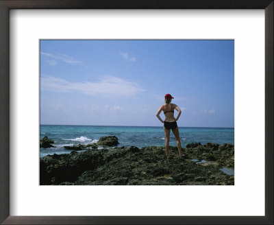 A Woman Stands Looking At The Mediterranean In Menorca, Spain by Taylor S. Kennedy Pricing Limited Edition Print image