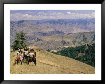 A Group Of Horseback-Riding Tourists Take In The View Of Hells Canyon by Richard Nowitz Pricing Limited Edition Print image