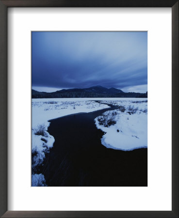 Clouds Fill The Sky, And Snow And Ice Cover Connery Pond by Michael Melford Pricing Limited Edition Print image