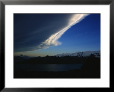 Clouds Light Up The Sky Just Before Sunset Over The Mountains Of South Georgia Island by Maria Stenzel Pricing Limited Edition Print image