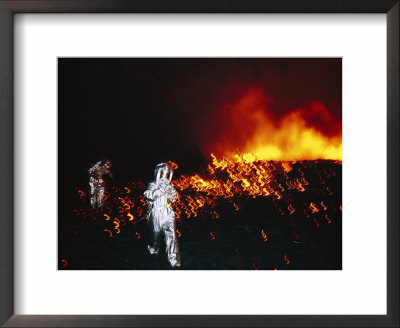 Climbers In Protective Clothing Move Away From The Lava Lake by Peter Carsten Pricing Limited Edition Print image