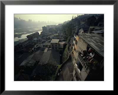 Woman Hangs Laundry In One Of The Houses Along The Yangtze River by Eightfish Pricing Limited Edition Print image
